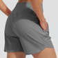 Pantalones cortos de atletismo para mujer con bolsillos