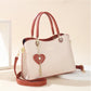 Elegante bolso tote para mujer con dije de corazón brillante